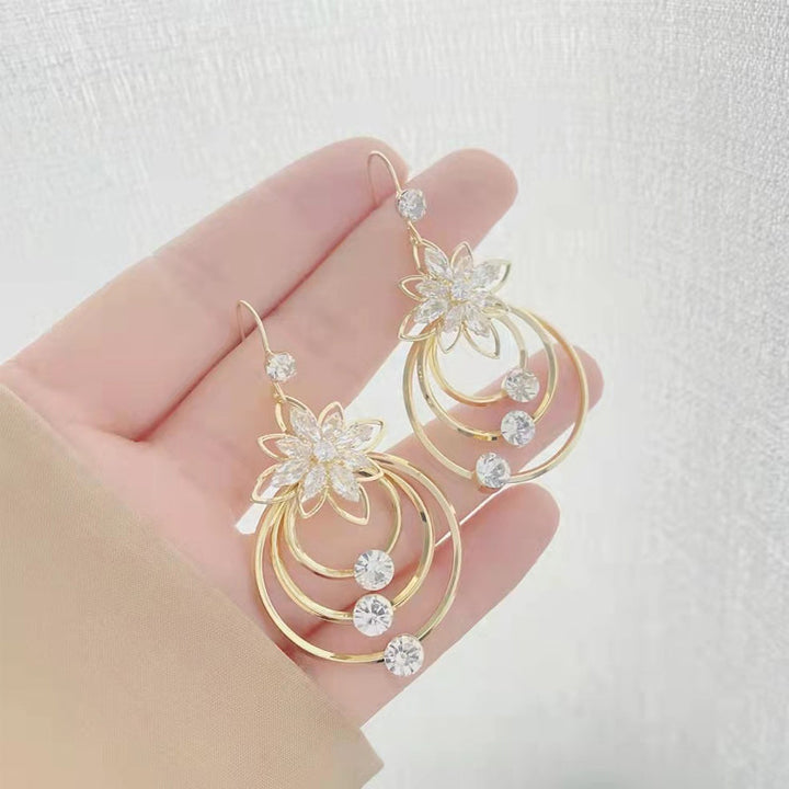 Crystal Lotus Tre Ringer Øredobber Luvikno