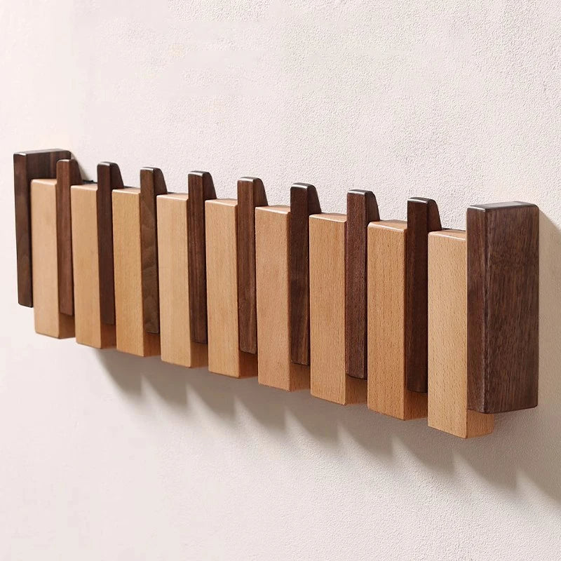 Tre vegghenger i piano design med sammenleggbare kroker | Luvikno