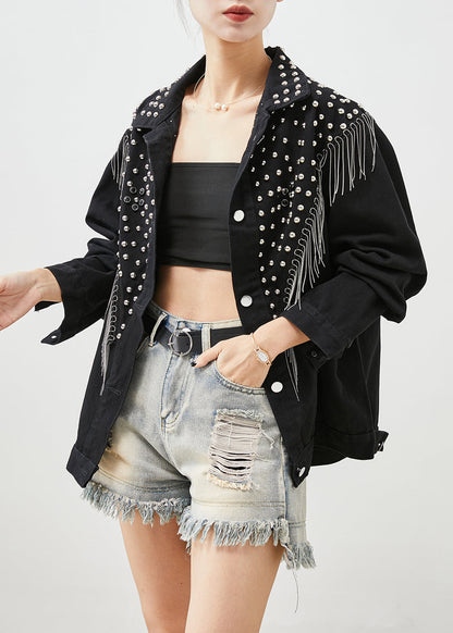 Luvik | Musta denim-takki, jossa on niittejä ja layrisiä