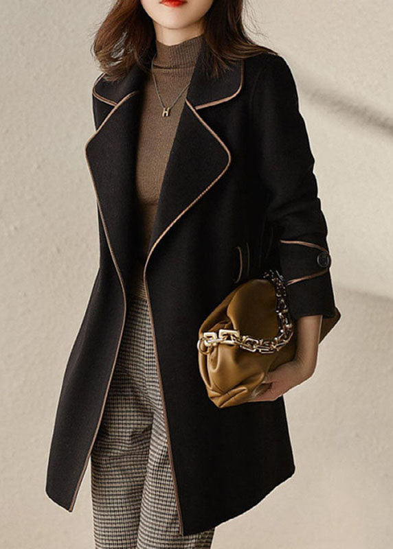 Luvik | Svart patchwork-belt til jakker med ullrevender.