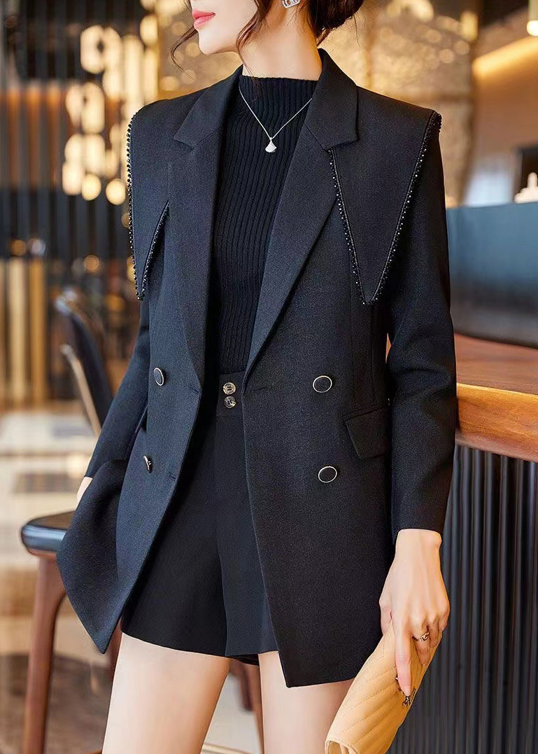 Luvik | Musta Peter Pan -kauluksella oleva puuvillasta valmistettu tilkkutakkia