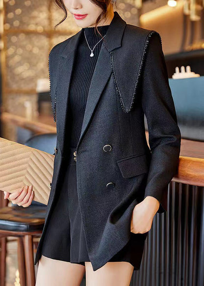 Luvik | Musta Peter Pan -kauluksella oleva puuvillasta valmistettu tilkkutakkia