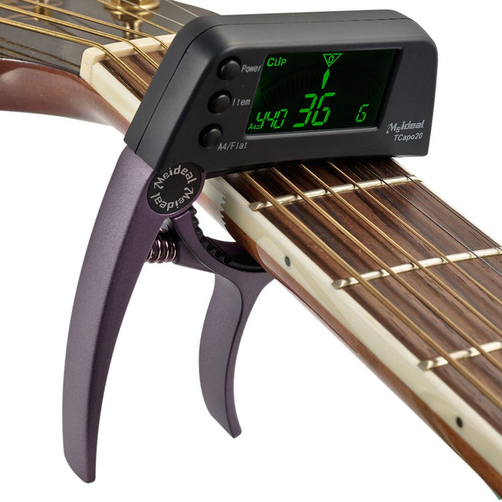 Capo & Tuner "TuneGrip" – 2-i-1 gitar tilbehør med LCD-skjerm | Luvikno