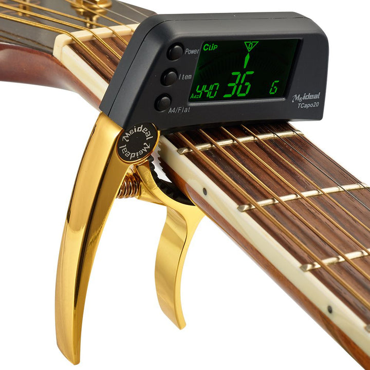 Capo & Tuner "TuneGrip" – 2-i-1 gitar tilbehør med LCD-skjerm | Luvikno