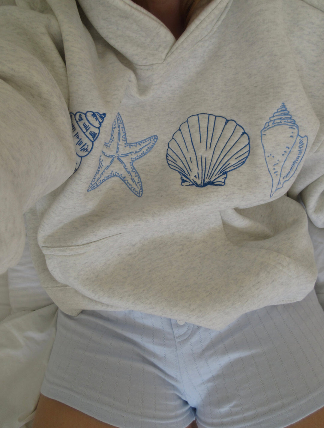 Luvik | Unisex-huppari, jossa on simpukoita