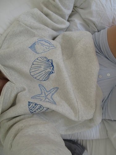 Luvik | Unisex-huppari, jossa on simpukoita