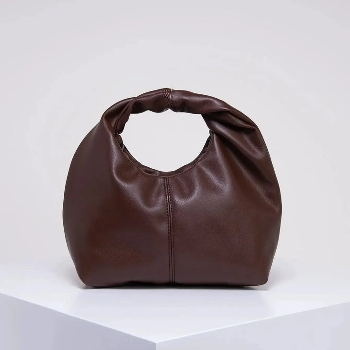 Luvik | Laukku Moteknyteveske Clutch Bag Kädessä oleva laukku