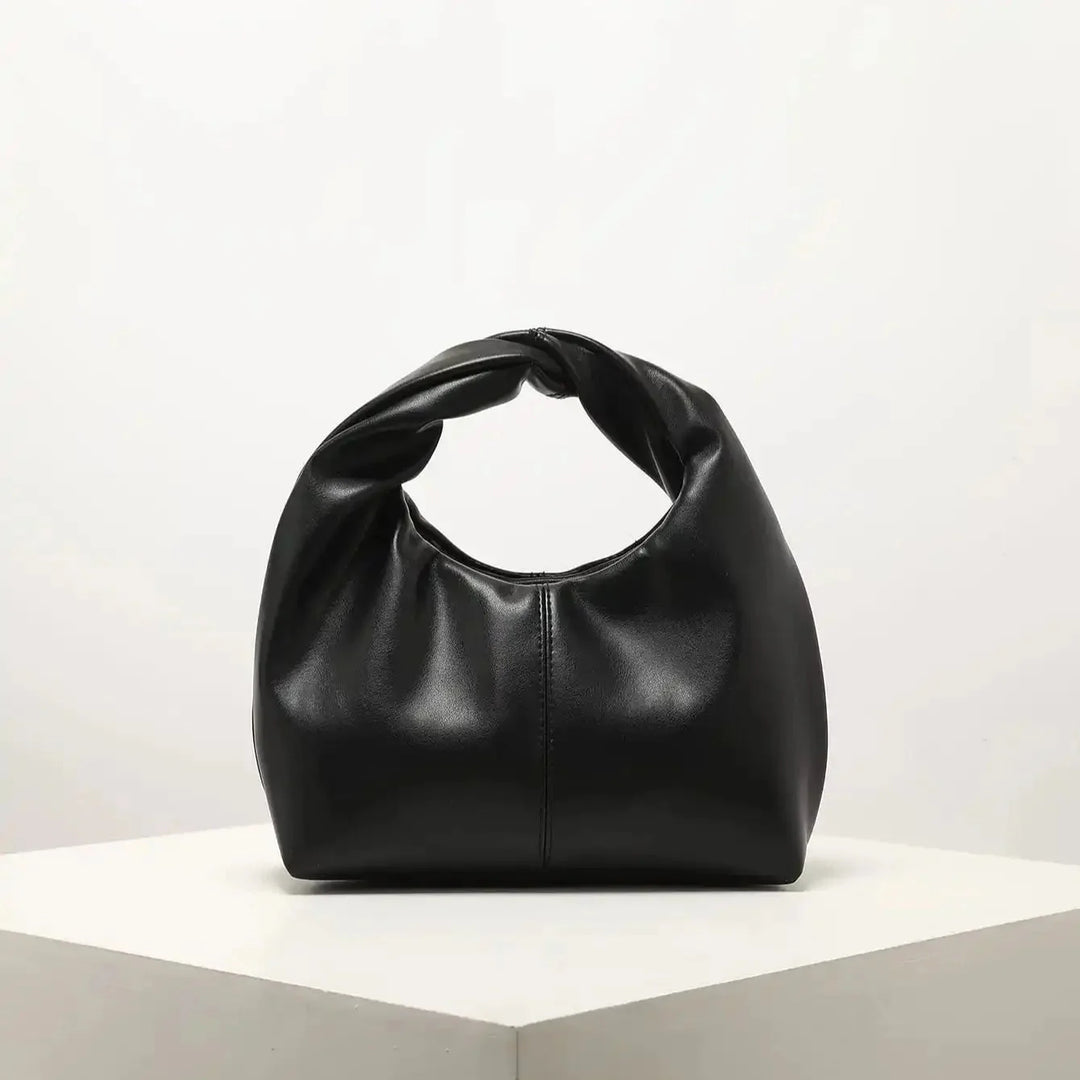 Luvik | Laukku Moteknyteveske Clutch Bag Kädessä oleva laukku