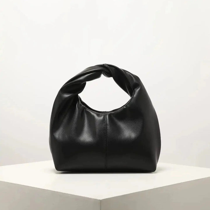 Luvik | Laukku Moteknyteveske Clutch Bag Kädessä oleva laukku