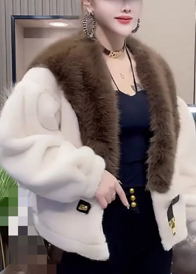 Luvik | Oranssi turkisnapilla varustettu patchwork-minkkitakki