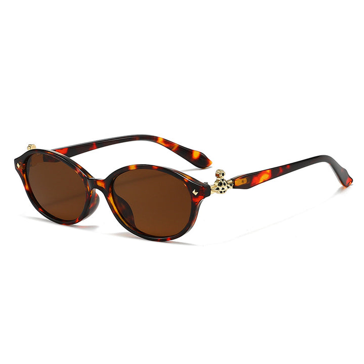 Dame motekunstig brille i elegant ova-design med gyldne aksenter Luvikno