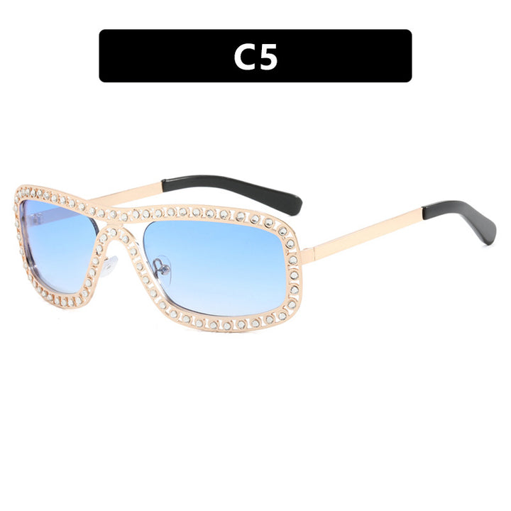 Dame moteriktig solbrille med glitrende ramme Luvikno