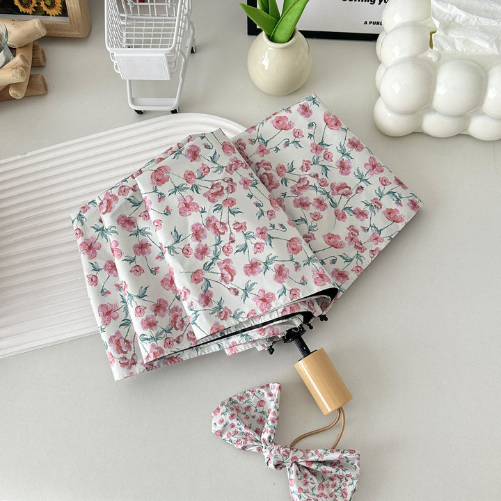 Dame sammenleggbare paraply med blomsterdesign og praktisk oppbevaringssystem Luvikno