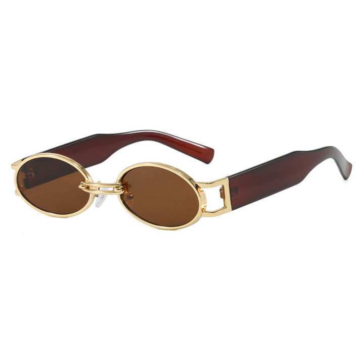 Dame ovalformet solbrille med gullige accenter og stilig ramme Luvikno