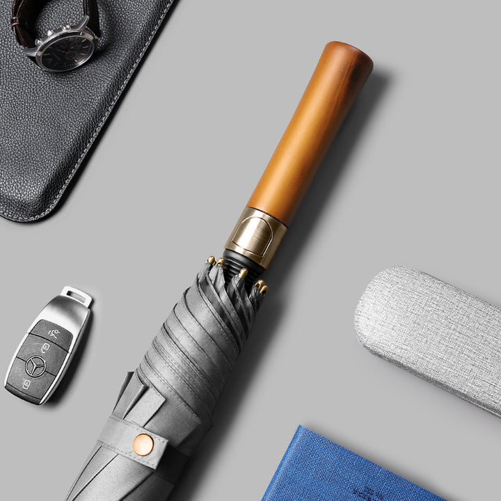 Dame elegant sammenleggbart regnparaply med ergonomisk treskaft og vindresistent teknologi Luvikno