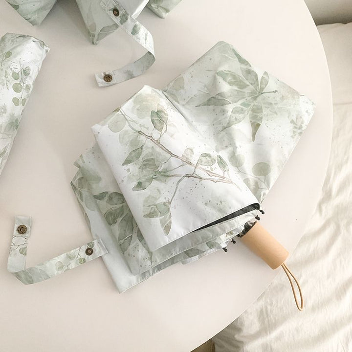Damer Faltparaply med botanisk trykkdesign Luvikno