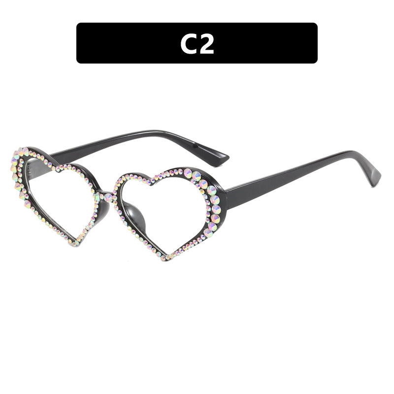 Dame hjerteformet solbrille med strassbesatt ramme Luvikno