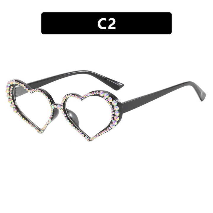Dame hjerteformet solbrille med strassbesatt ramme Luvikno