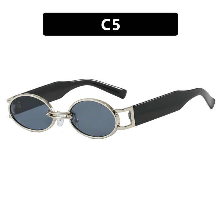 Dame ovalformet solbrille med gullige accenter og stilig ramme Luvikno
