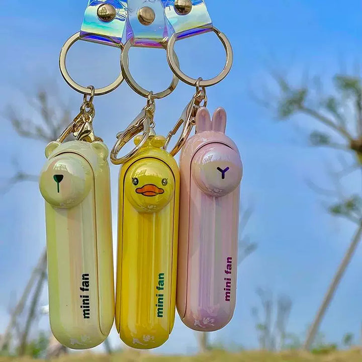Unisex enhetsstørrelse oppladbar nøkkelring håndholdt mini-vifte med håndleddsstropp og ny art frosk charm Luvikno