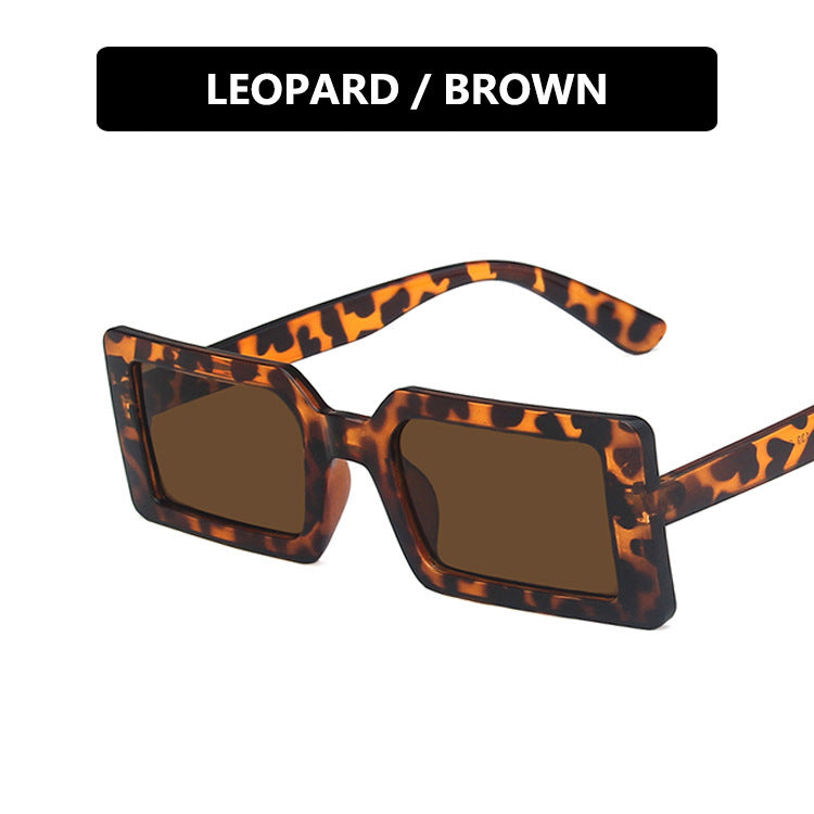 Dame kvadratisk solbrille med moderne, bred ramme og beskyttende UV-filter Luvikno