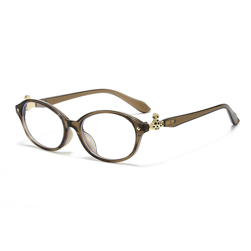 Dame motekunstig brille i elegant ova-design med gyldne aksenter Luvikno