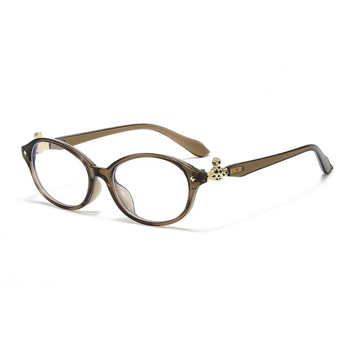 Dame motekunstig brille i elegant ova-design med gyldne aksenter Luvikno