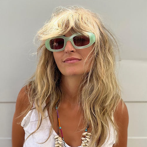 Dame Modisk solbrille med myk, buet ramme Luvikno