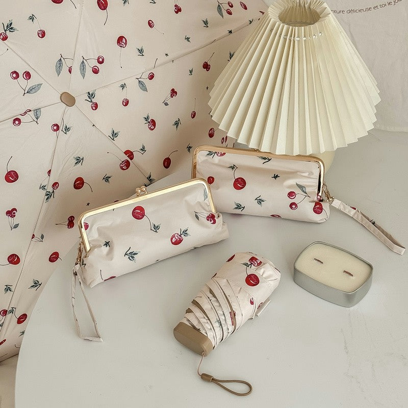 Damer elegant foldeparaply med blomsterdesign og praktisk etui Luvikno