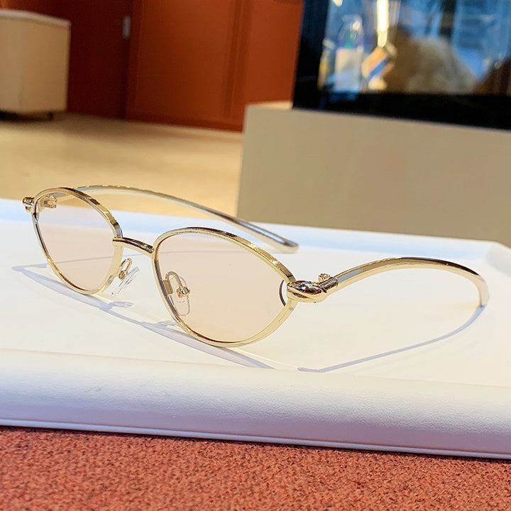 Dame Designer-solbriller med elegant metallramme og beskyttende glass Luvikno