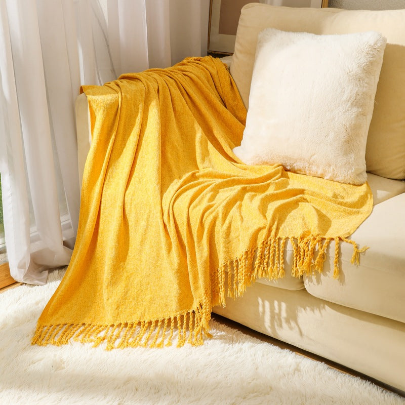 Kvinnelig elegant og stilfull sofa teppe med frynser Luvikno