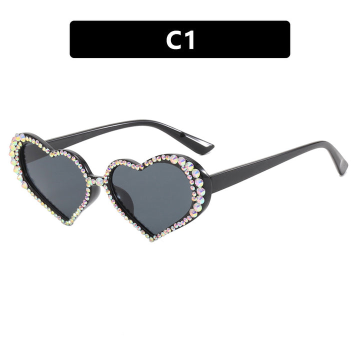 Dame hjerteformet solbrille med strassbesatt ramme Luvikno
