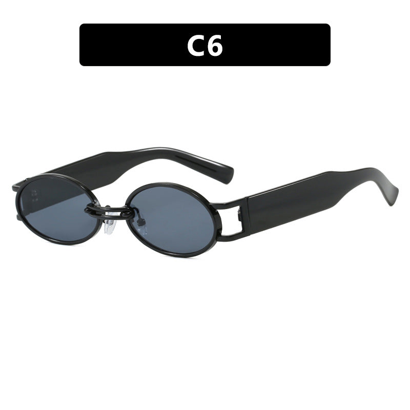 Dame ovalformet solbrille med gullige accenter og stilig ramme Luvikno