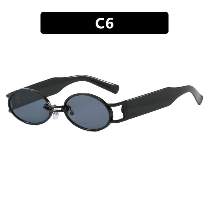 Dame ovalformet solbrille med gullige accenter og stilig ramme Luvikno