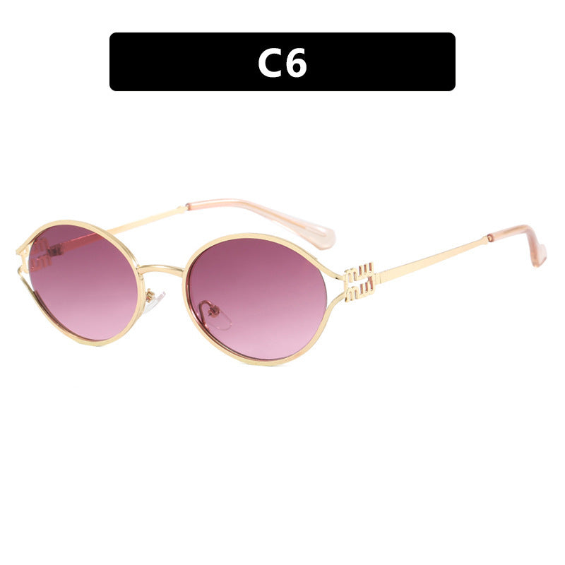 Dame ovalformet solbrille med elegant metallramme og moderne design Luvikno