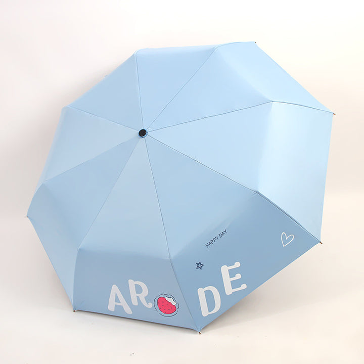 Kvinnens sammenleggbare paraply med lystig design Luvikno