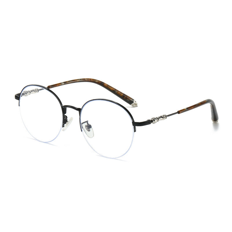 Dame rund solbrille med elegant metallramme og komfortable nesepads Luvikno