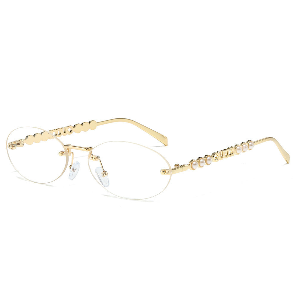 Dame moteriktig solbrille med oval ramme og perledekorert bøyle Luvikno