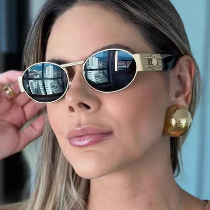 Dame rund solbrille med moderne metallramme og UV-beskyttelse Luvikno