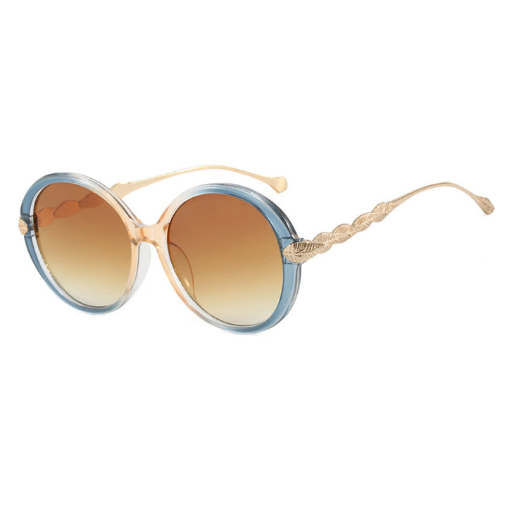 Dame stor rund solbrille med dekorative metalakser Luvikno