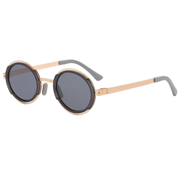 Damer moteriktig rund solbrille med elegant metallramme Luvikno