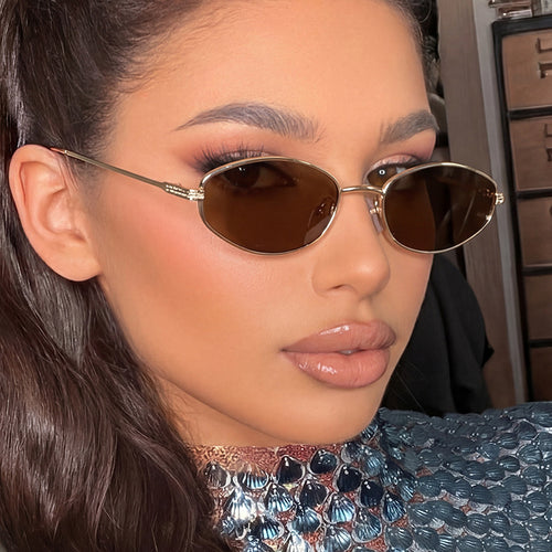 Dame moteriktig solbrille i minimalistisk ovalt design Luvikno