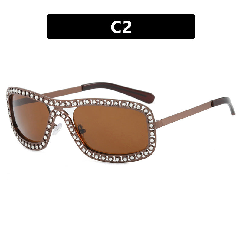 Dame moteriktig solbrille med glitrende ramme Luvikno