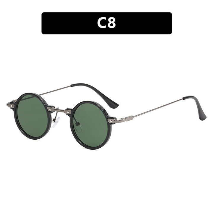 Dame rund solbrille med moderne metallramme og store blå linser Luvikno