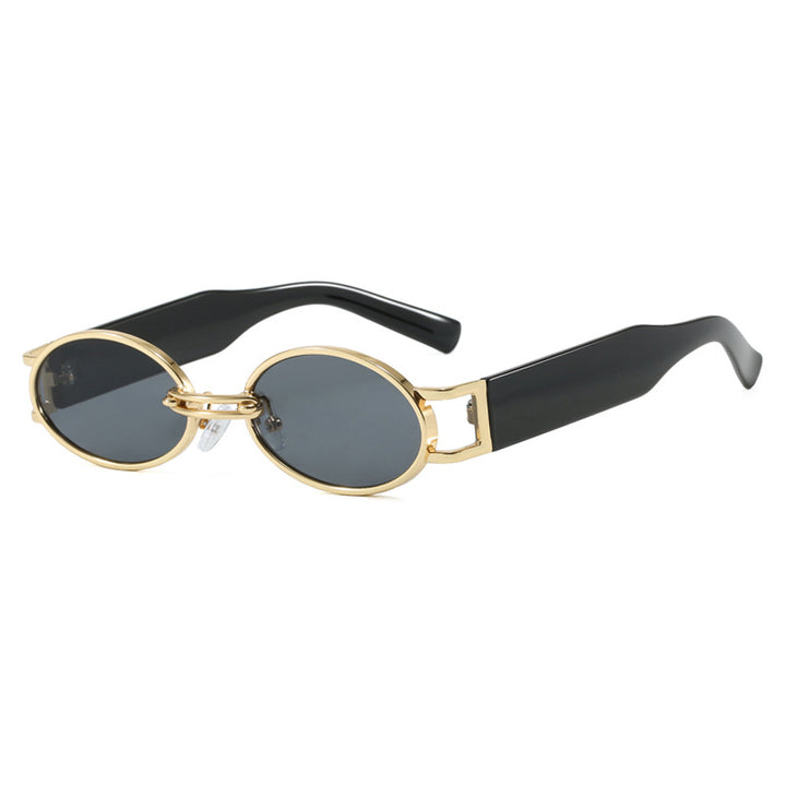 Dame ovalformet solbrille med gullige accenter og stilig ramme Luvikno