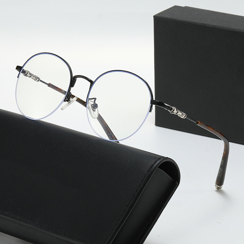Dame rund solbrille med elegant metallramme og komfortable nesepads Luvikno