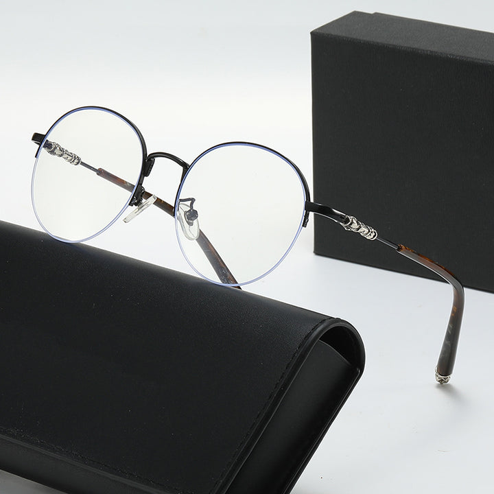 Dame rund solbrille med elegant metallramme og komfortable nesepads Luvikno