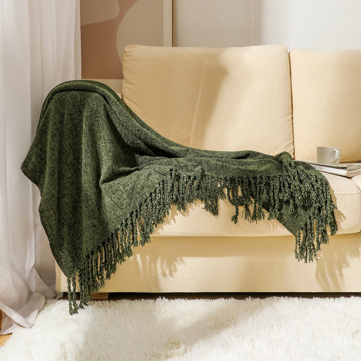 Kvinnelig elegant og stilfull sofa teppe med frynser Luvikno