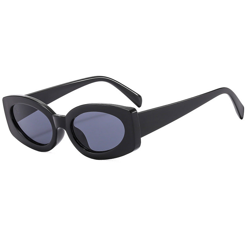Dame moteriktig solbrille med unikt, bølget ramme Luvikno