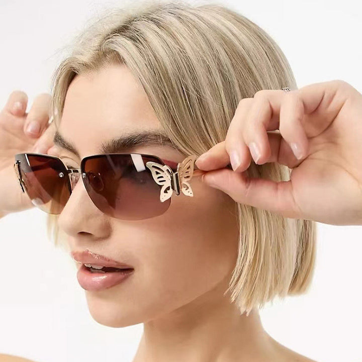 Dame moteriktig solbrille med filigran sommerfugldesign og beskyttende glass Luvikno